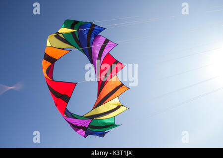 Spiral multi-coloured rotating kites at Lytham St Annes, Blackpool, 2nd September, 2017. St. Annes kite festival.  The skies above Saint Annes-on-sea, seafront were awash with colour as fabulous display kites took to the air on the beach adjacent to the pier.  The event featured single line kites of all shapes and sizes, including this gyrokite and windmill kite,  2-line and 4-line stunt kites.   Credit:  MedaiWorldImages/Alamy Live News. Stock Photo