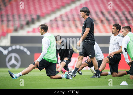 Stuttgart, Germany. 03rd Sep, 2017. Germany's coach Joachim Loew watches his players doing warm-ups during a training session in the Mercedes-Benz Arena in Stuttgart, Germany, 03 September 2017. Germany will play against Norway in the soccer World Cup qualification match against Norway on 04 September 2017. Photo: Sebastian Gollnow/dpa/Alamy Live News Stock Photo