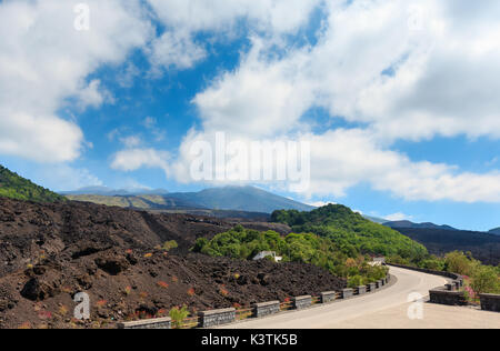 Serpentine road view from foot of summer Etna volcano mountain, Sicily, Italy