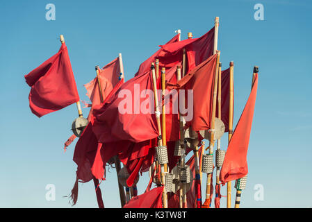 Flags and buoys for fishing nets on a fishing boat in the port of Vitte, Hiddensee, Mecklenburg-West Pomerania, Germany Stock Photo