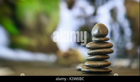 Zen stones stacked on abstract nature background Stock Photo