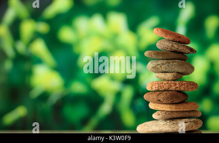 Zen stones stacked on abstract nature background Stock Photo