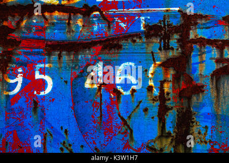 Abstract of rust and blue and red paint on metal Stock Photo