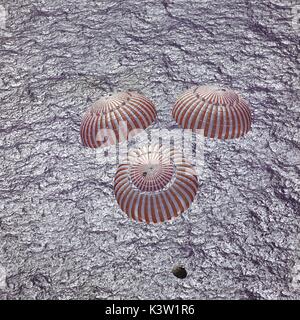 The NASA Apollo 16 command module prepares to land in the water after returning from a lunar landing mission April 27, 1972 in the Pacific Ocean.  (photo by NASA via Planetpix) Stock Photo