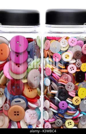 colorful sewing buttons in a bottle on white background Stock Photo