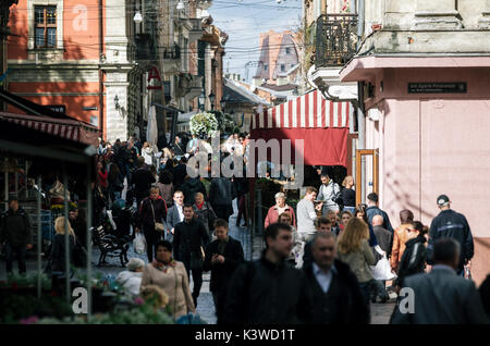 Lviv, Ukraine - September 23, 2016: Crowd of tourists on Galytska Street in Old Town close to Rynok Square Market Square in Lviv, Ukraine. Stock Photo