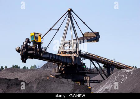 Stacker-reclaimer in a coal handling terminal. Stock Photo