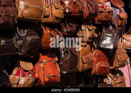 Shopping in the busy North Laine area of Brighton, a selection of leather bags on display Stock Photo