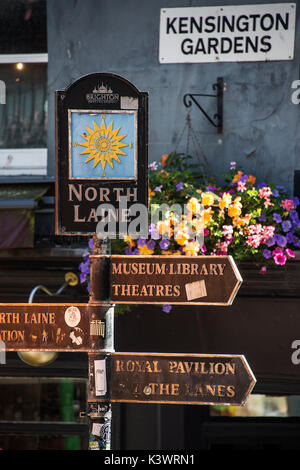 Shopping in the busy North Laine area of Brighton. A fingerpost direction sign Stock Photo
