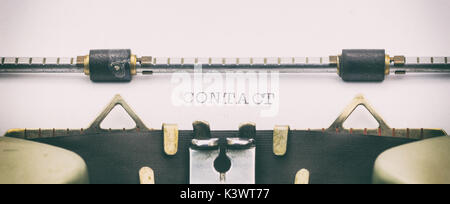 Close-up of word Contact on typewriter sheet Stock Photo