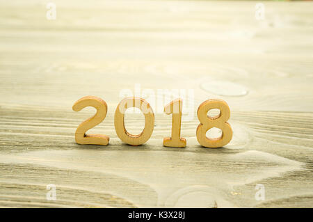 2018 the year of the wooden figures on wooden background Stock Photo