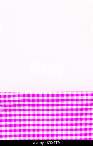 Pink, purple fabric, a kitchen towel with a checkered pattern, on a white background isolated. Stock Photo