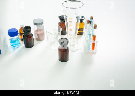 Measuring glass, test tubes and glass jars. Healthcare and biotechnology concept Stock Photo