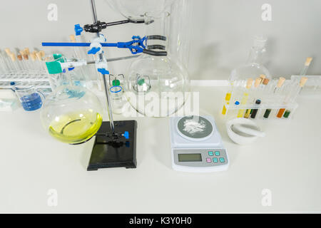 Chemical analysis glassware with measuring apparatus in laboratory. Healthcare and biotechnology concept Stock Photo