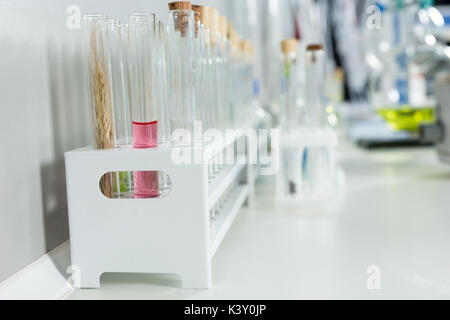 Close up of chemical test tubes in laboratory. Healthcare and biotechnology concept Stock Photo