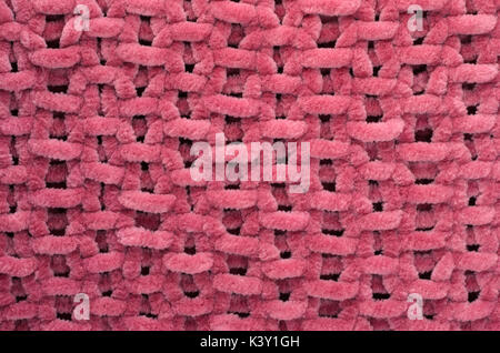 Handmade knitted large burgundy blanket. Fabric background texture. Stock Photo
