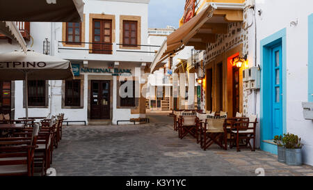 Coffee shops in the central square of Skala village on Patmos island in Greece. Stock Photo