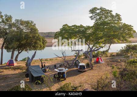 A camp site with tents on the banks of the Runde river viewed from an elevated position Stock Photo