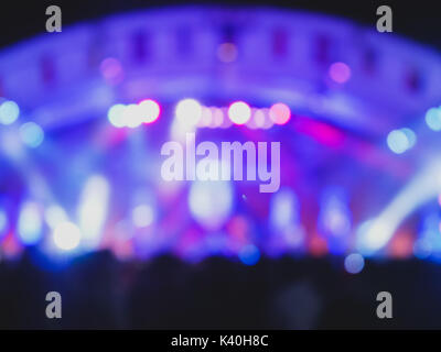 defocused entertainment concert lighting on stage blurred disco party Stock Photo