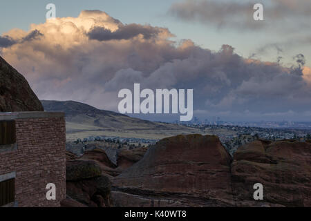 A big cloud sits over Denver during sunset, viewed from nearby Morrison, Colorado. Stock Photo