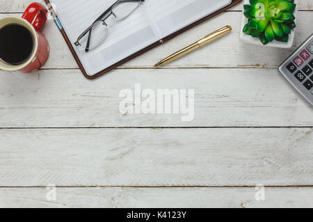 Aerial view items stationary of finances or accountant on office desk background concept. Several essential accessories on modern rustic white wooden. Stock Photo