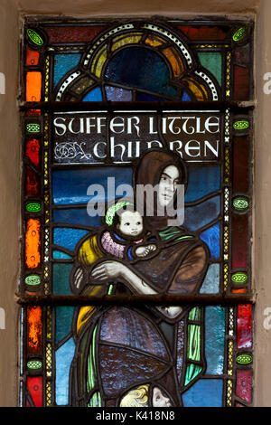 Suffer the little children stained glass, St. Peter and St. Paul Church, Kingsbury, Warwickshire, England, UK Stock Photo