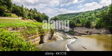 Standing at the summit of the middle falls in Letchworth State Park in Castile NY along the Genesee river looking down the valley of the gorge.  This  Stock Photo