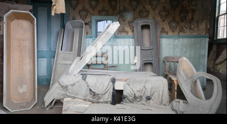 Empty coffins inside rustic frontier morgue in Bodie Historic State Park, California. Stock Photo