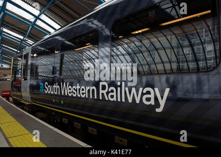 South Western Railway's first fully-liveried Class 444 train arrives into the former international terminal at Waterloo station in central London as the train operating company launches its new brand. Stock Photo