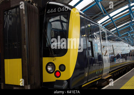 South Western Railway's first fully-liveried Class 444 train arrives into the former international terminal at Waterloo station in central London as the train operating company launches its new brand. Stock Photo