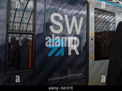 South Western Railway's first fully-liveried Class 444 train arrives into the former international terminal at Waterloo station in central London as the train operating company launches its new brand. Stock Photo