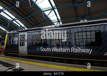 South Western Railway's first fully-liveried Class 444 train arrives into the former international terminal at Waterloo station in central London as the train operating company launches its new brand. Stock Photo