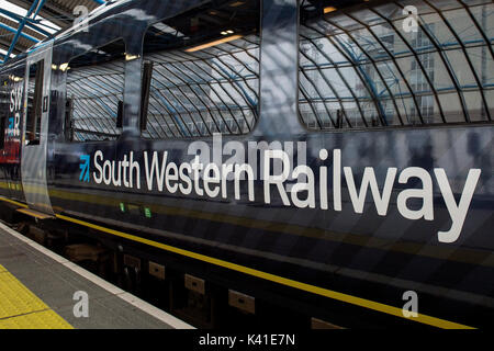 South Western Railway's first fully-liveried Class 444 train arrives into the former international terminal at Waterloo station in central London as the train operating company launches its new brand. Stock Photo