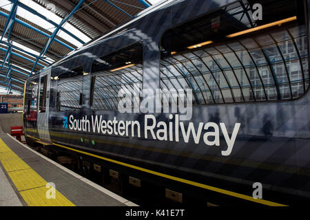 South Western Railway's first fully-liveried Class 444 train arrives into the former international terminal at Waterloo station in central London as the train operating company launches its new brand. Stock Photo