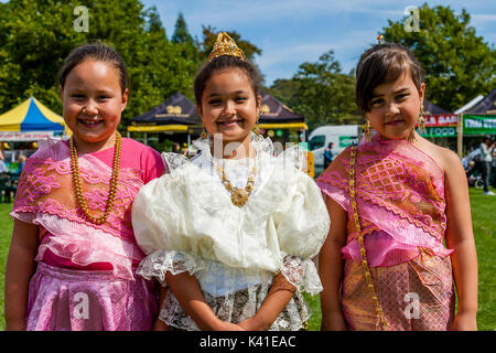Three Anglo-Thai Children Dressed In Traditional Thai Costume, Brighton Thai Festival, Brighton, Sussex, UK Stock Photo