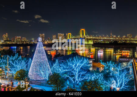 Illuminated Rainbow Bridge in Tokyo, Japan Stock Photo