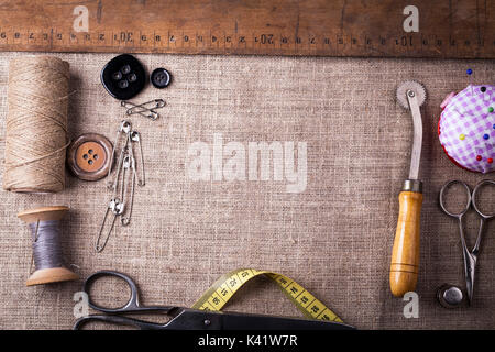 Sewing instruments, threads, needles, bobbins and materials. Studio photo Stock Photo