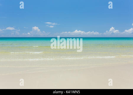 Tropical white sand beach with turquoise water under blue sky. Paradise background Stock Photo