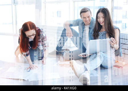 Cheerful colleagues working in the office Stock Photo