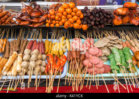 Sausage, meat products and meat balls. Thai style street food. Stock Photo