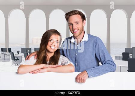 Digital composite of Business people holding blank card in office Stock Photo