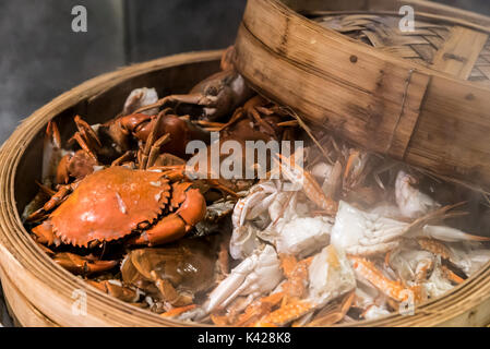 steam crab in cooking seafood steamer basket Stock Photo