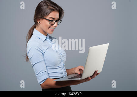 Young business woman using the laptop Stock Photo