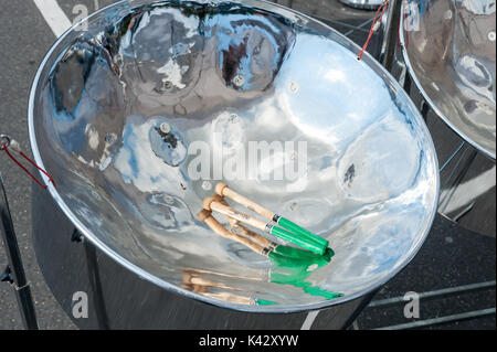 Steelpan drums also known as steel drums and sticks. Stock Photo