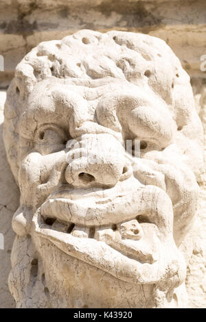 Italy, Venice, gargoyle, stone carving over doorway on building in Santa Maria Formosa. Stock Photo