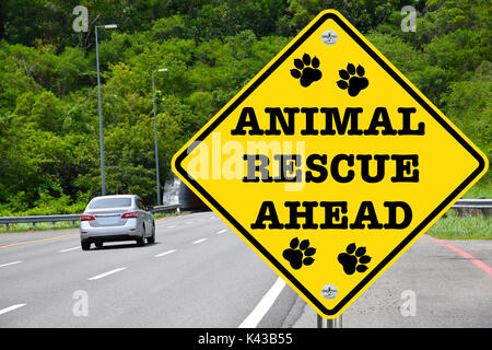 Animal rescue ahead warning sign for dangers that animals also face, and to remind us to lend a hand Stock Photo