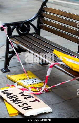 Warning signs for bench seat freshly varnished. Gibraltar. Stock Photo