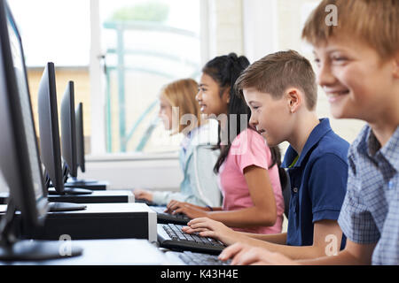 Male Elementary Pupil In Computer Class Stock Photo