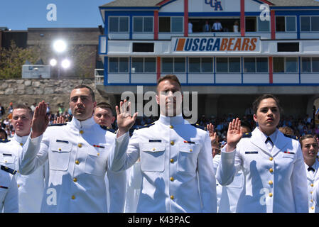 U.S. Coast Guard ensigns take the Oath of Office during the U.S. Coast Guard Academy commencement ceremony May 17, 2017 in New London, Connecticut.  (photo by PO2 Patrick Kelley  via Planetpix) Stock Photo