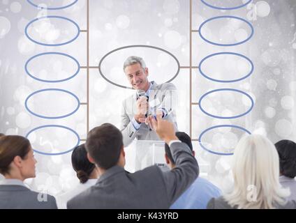 Digital composite of Group meeting and mind map over bright background Stock Photo